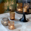 Different votives with candles